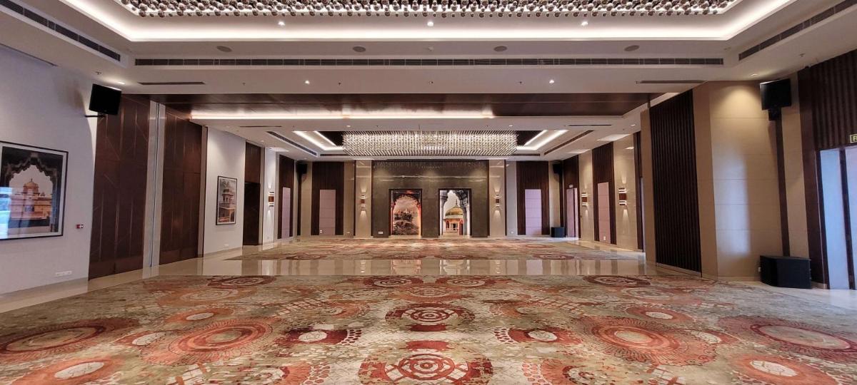 a large room with a large rug on the floor at Radisson Blu Hotel, Greater Noida in Greater Noida