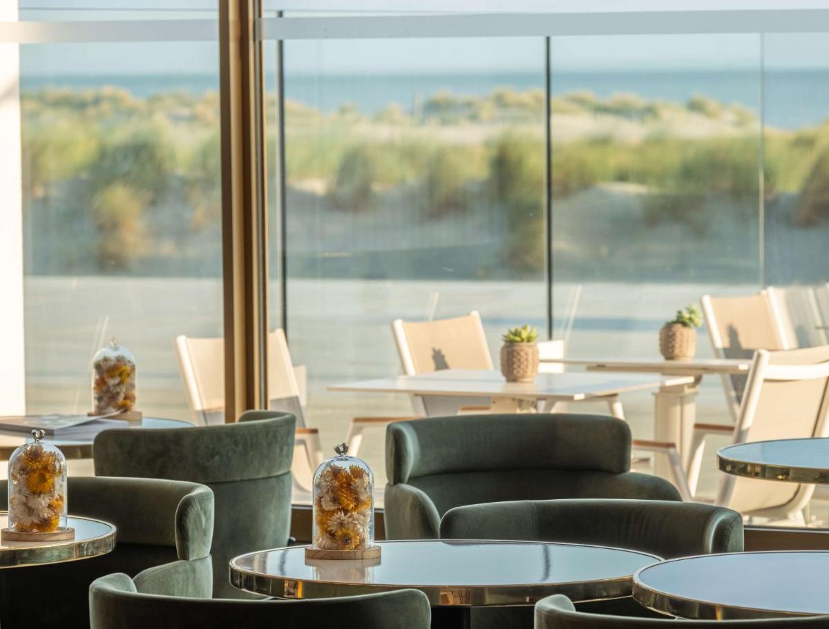 Coin salon dans l'établissement Radisson Blu Grand Hotel & Spa, Malo-Les-Bains
