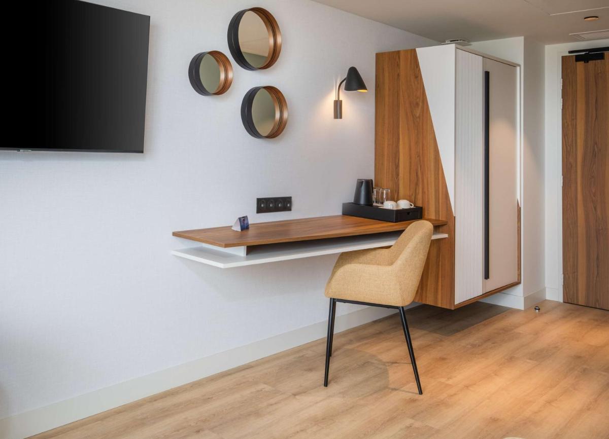 Télévision ou salle de divertissement dans l'établissement Radisson Blu Grand Hotel & Spa, Malo-Les-Bains
