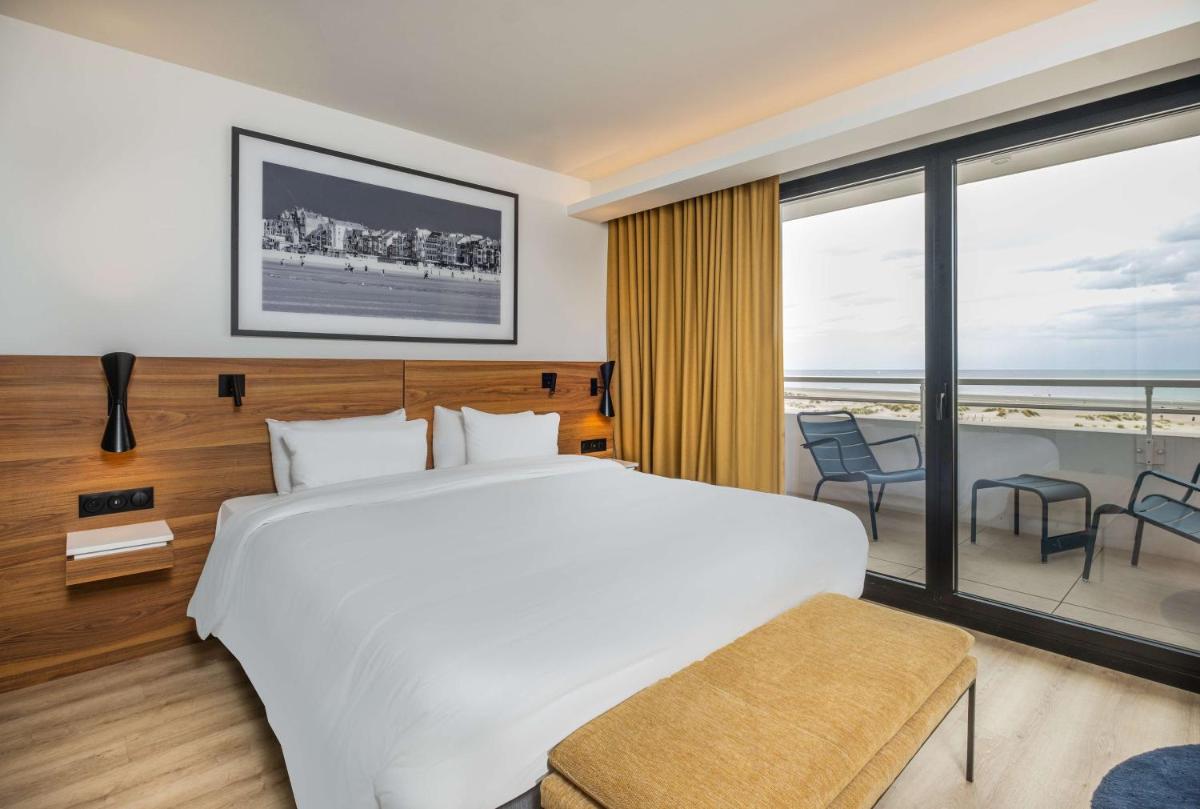 Un ou plusieurs lits dans un hébergement de l'établissement Radisson Blu Grand Hotel & Spa, Malo-Les-Bains