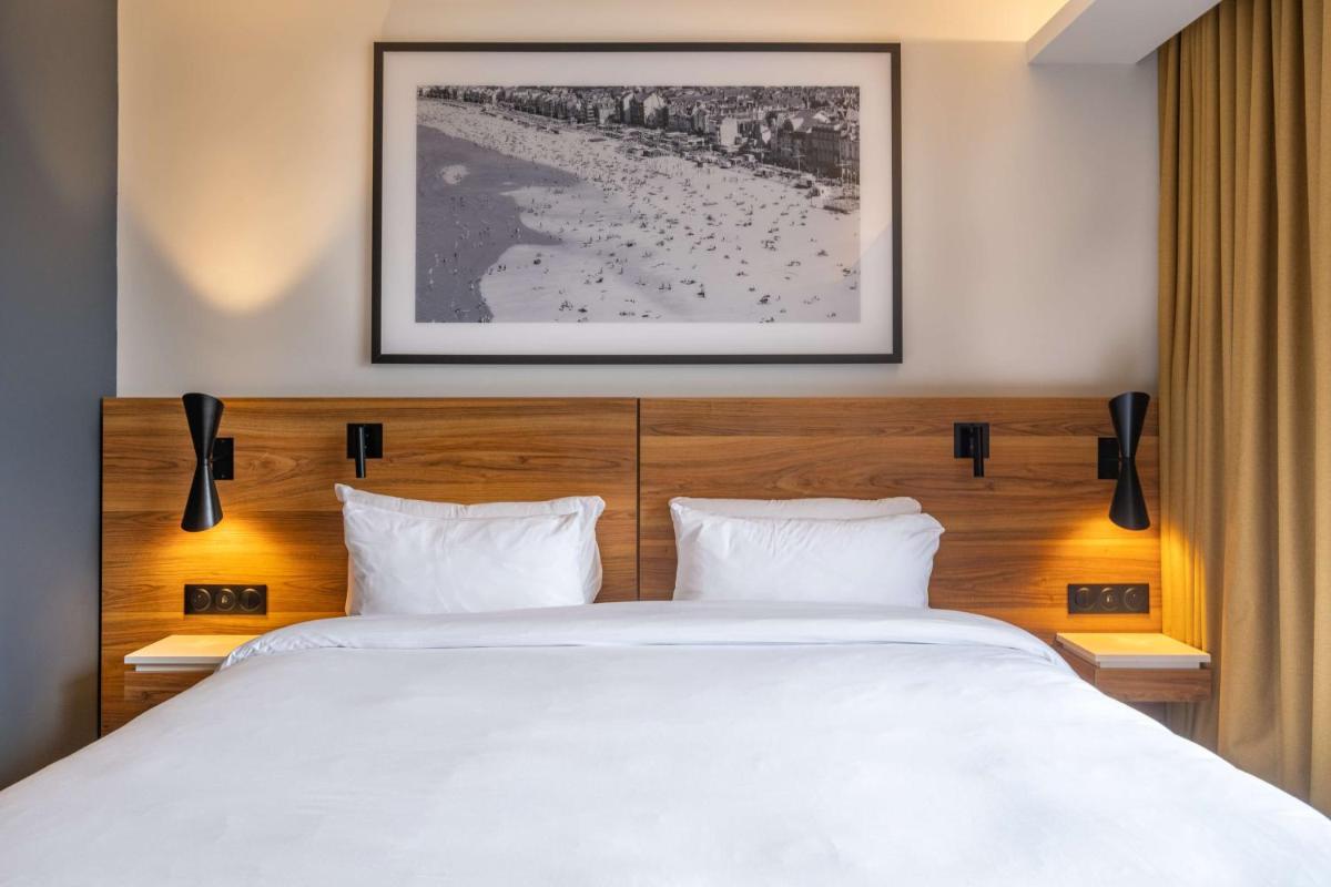 Un ou plusieurs lits dans un hébergement de l'établissement Radisson Blu Grand Hotel & Spa, Malo-Les-Bains