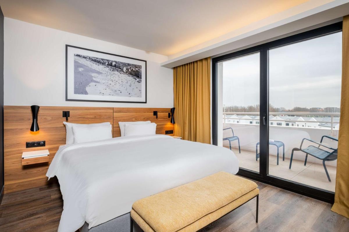 Un ou plusieurs lits dans un hébergement de l'établissement Radisson Blu Grand Hotel & Spa, Malo-Les-Bains
