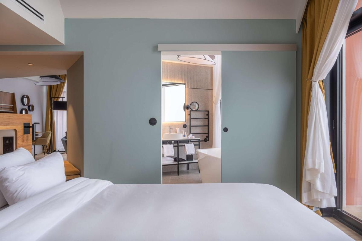 Un ou plusieurs lits dans un hébergement de l'établissement Radisson Blu Grand Hotel & Spa, Malo-Les-Bains