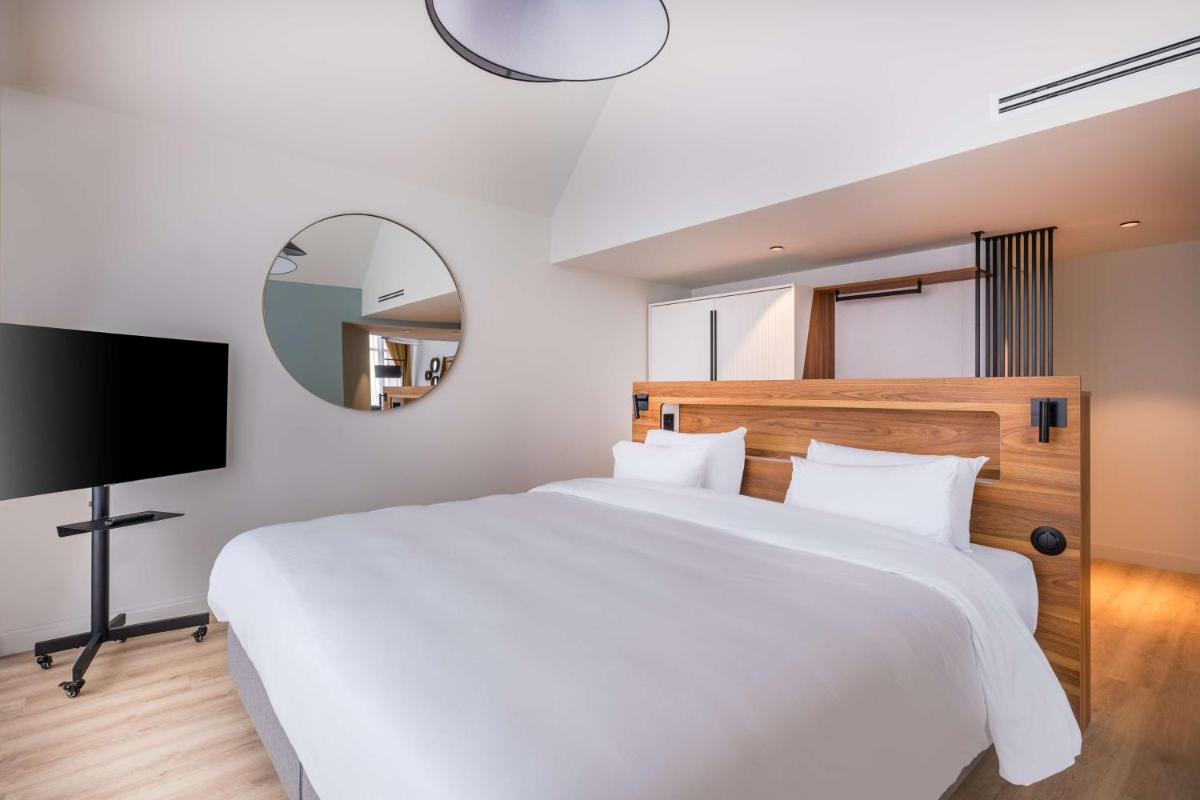 Un ou plusieurs lits dans un hébergement de l'établissement Radisson Blu Grand Hotel & Spa, Malo-Les-Bains