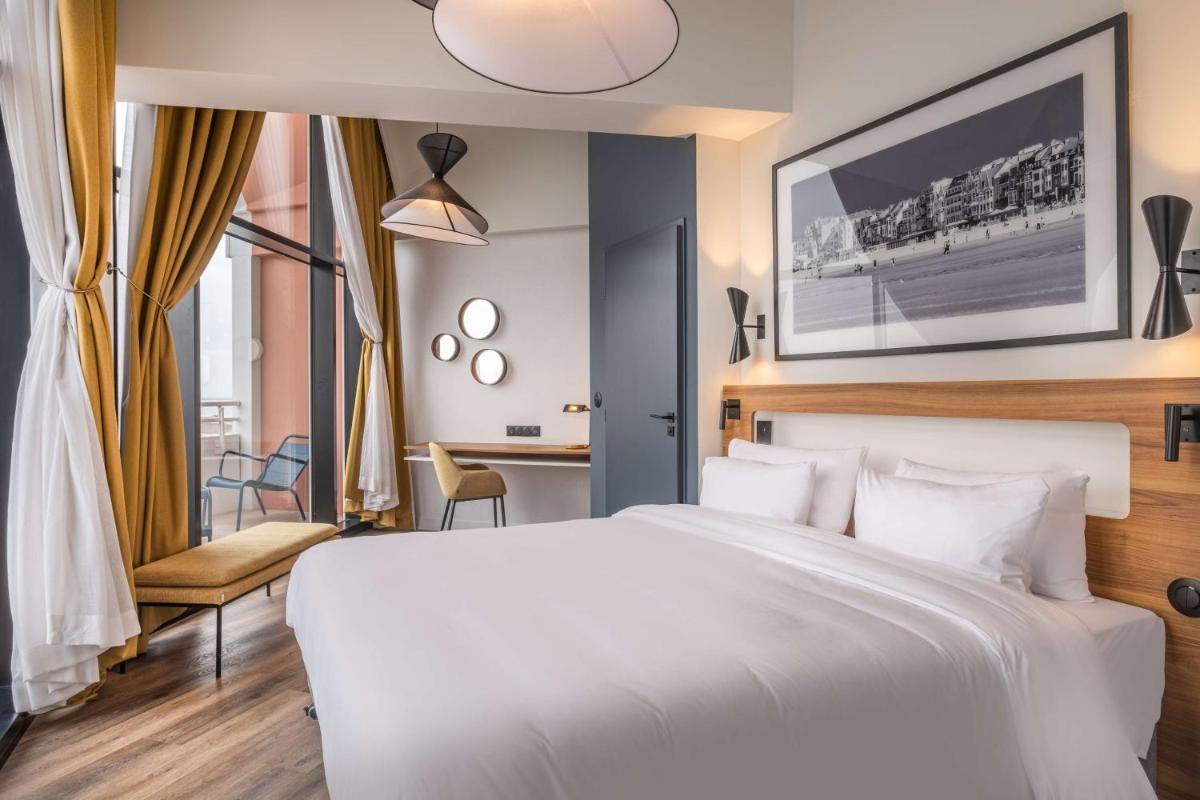 Un ou plusieurs lits dans un hébergement de l'établissement Radisson Blu Grand Hotel & Spa, Malo-Les-Bains