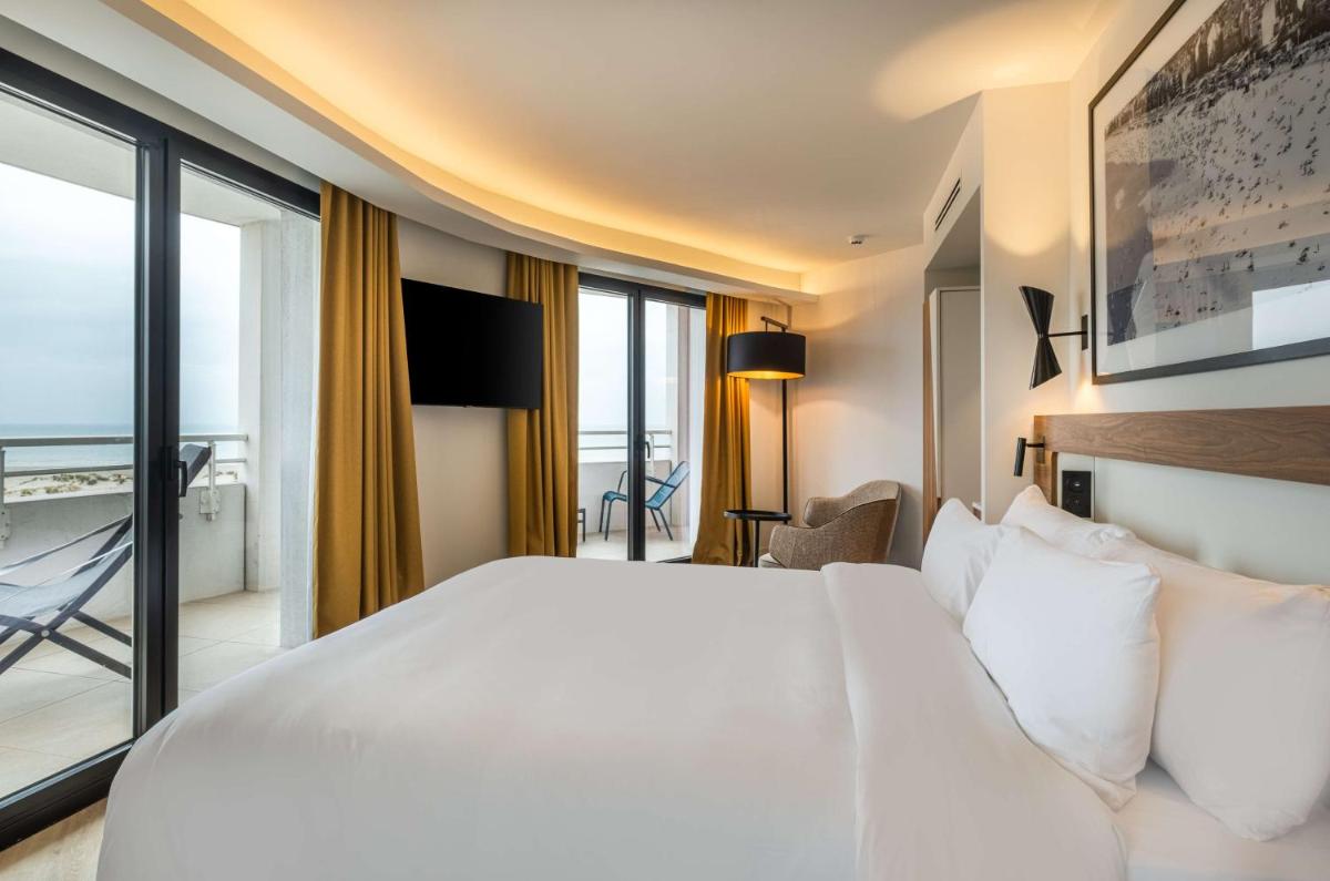 Un ou plusieurs lits dans un hébergement de l'établissement Radisson Blu Grand Hotel & Spa, Malo-Les-Bains