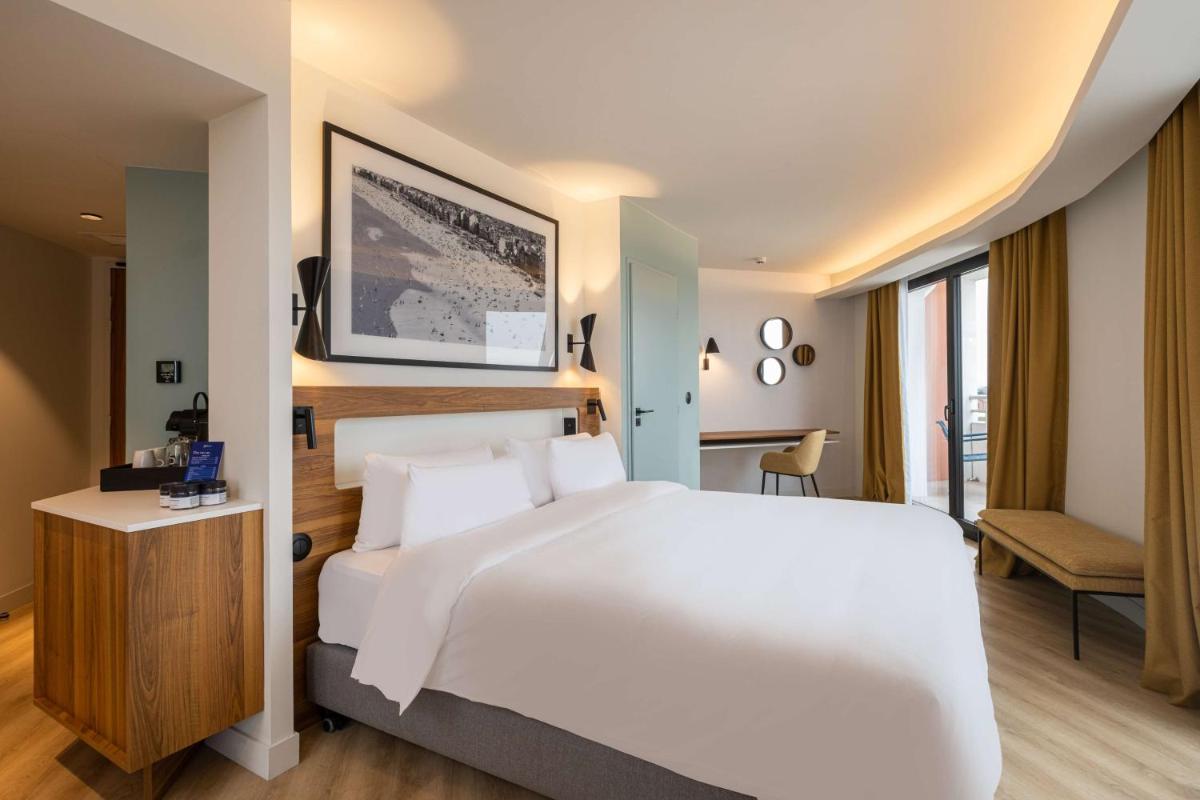 Un ou plusieurs lits dans un hébergement de l'établissement Radisson Blu Grand Hotel & Spa, Malo-Les-Bains