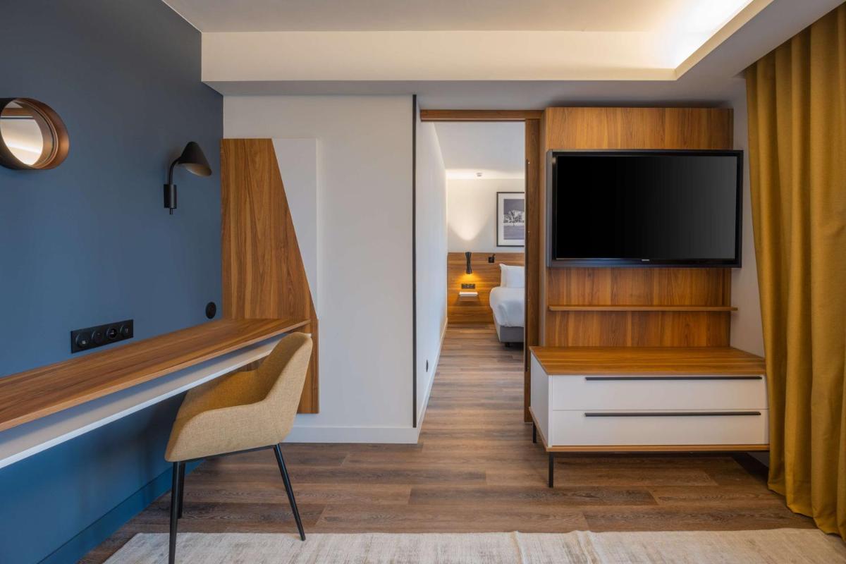 Télévision ou salle de divertissement dans l'établissement Radisson Blu Grand Hotel & Spa, Malo-Les-Bains