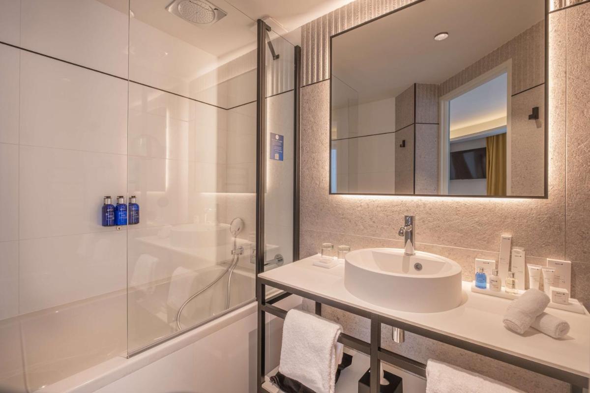 Salle de bains dans l'établissement Radisson Blu Grand Hotel & Spa, Malo-Les-Bains