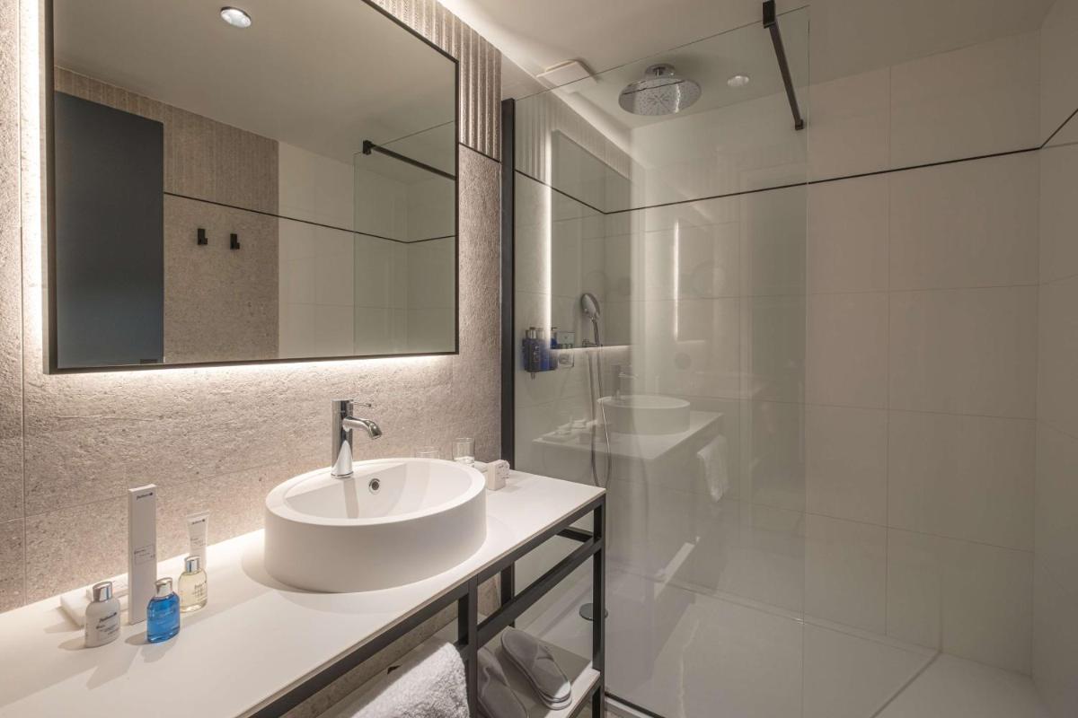 Salle de bains dans l'établissement Radisson Blu Grand Hotel & Spa, Malo-Les-Bains