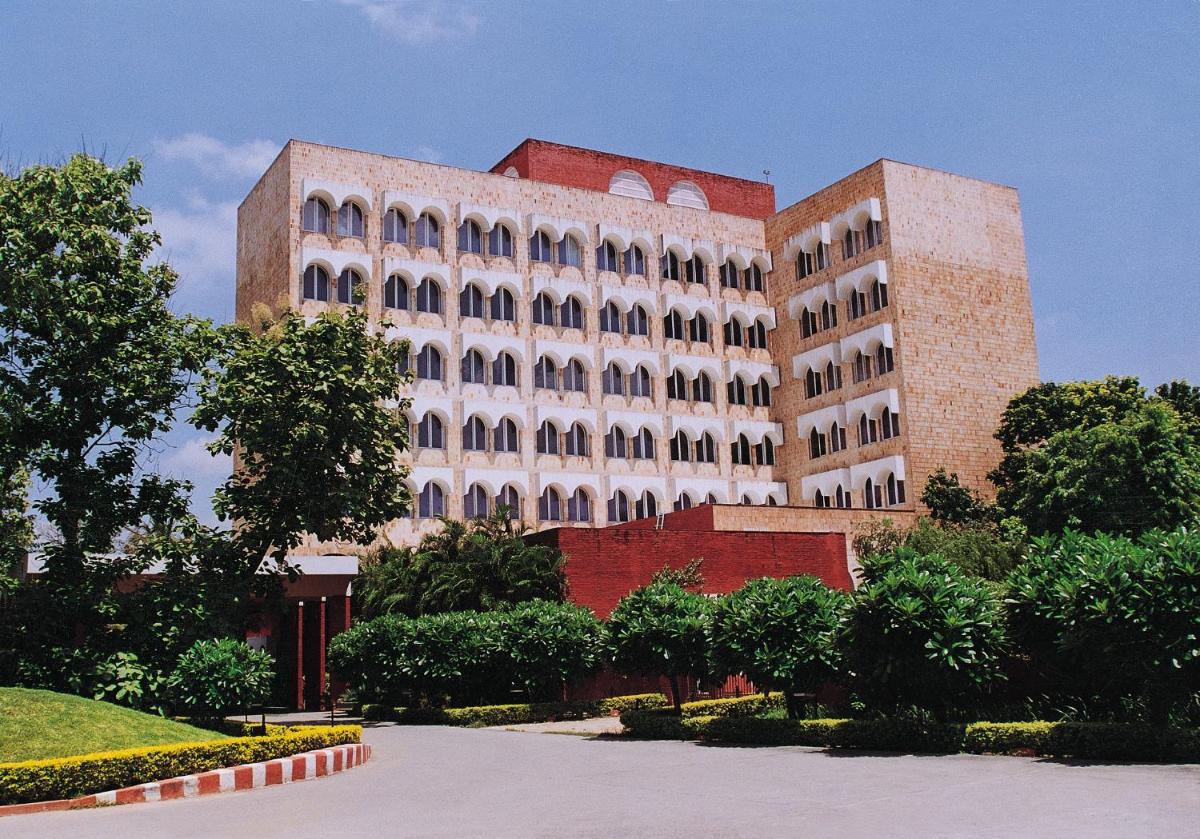 a large white building with a lot of windows at Taj Ganges Varanasi in Varanasi