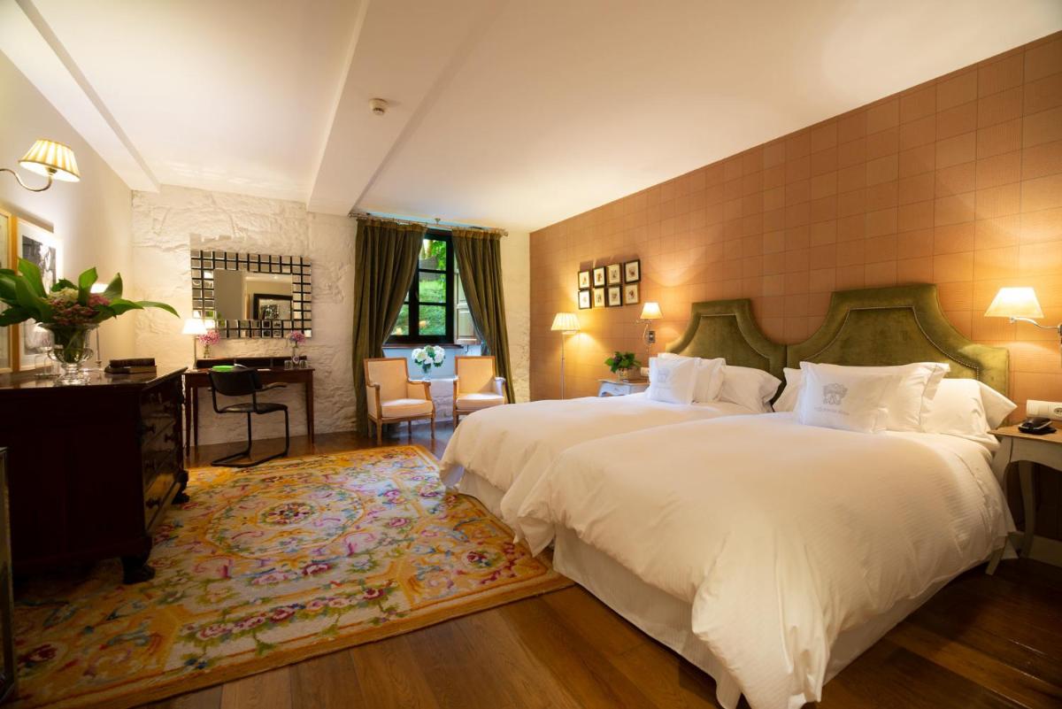 Cama o camas de una habitación en A Quinta Da Auga Hotel Spa Relais & Chateaux