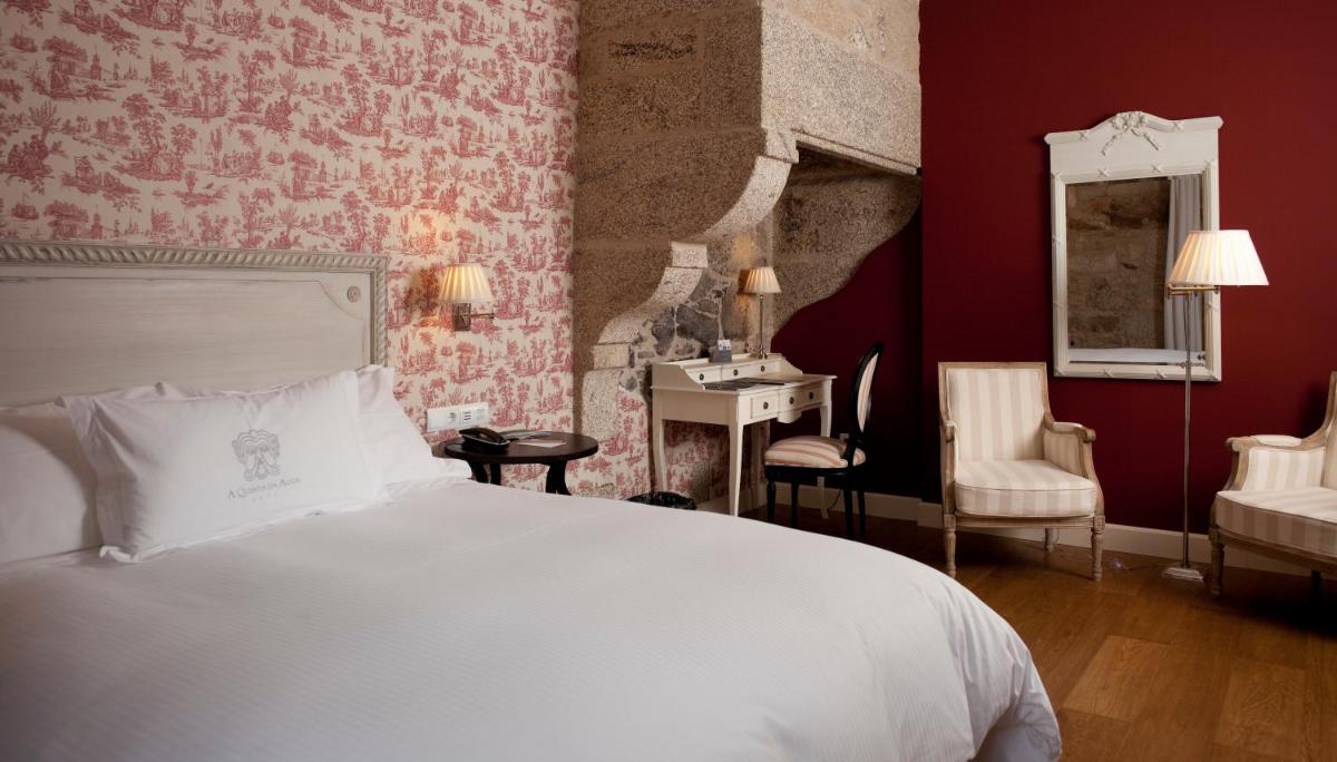 Cama o camas de una habitación en A Quinta Da Auga Hotel Spa Relais & Chateaux