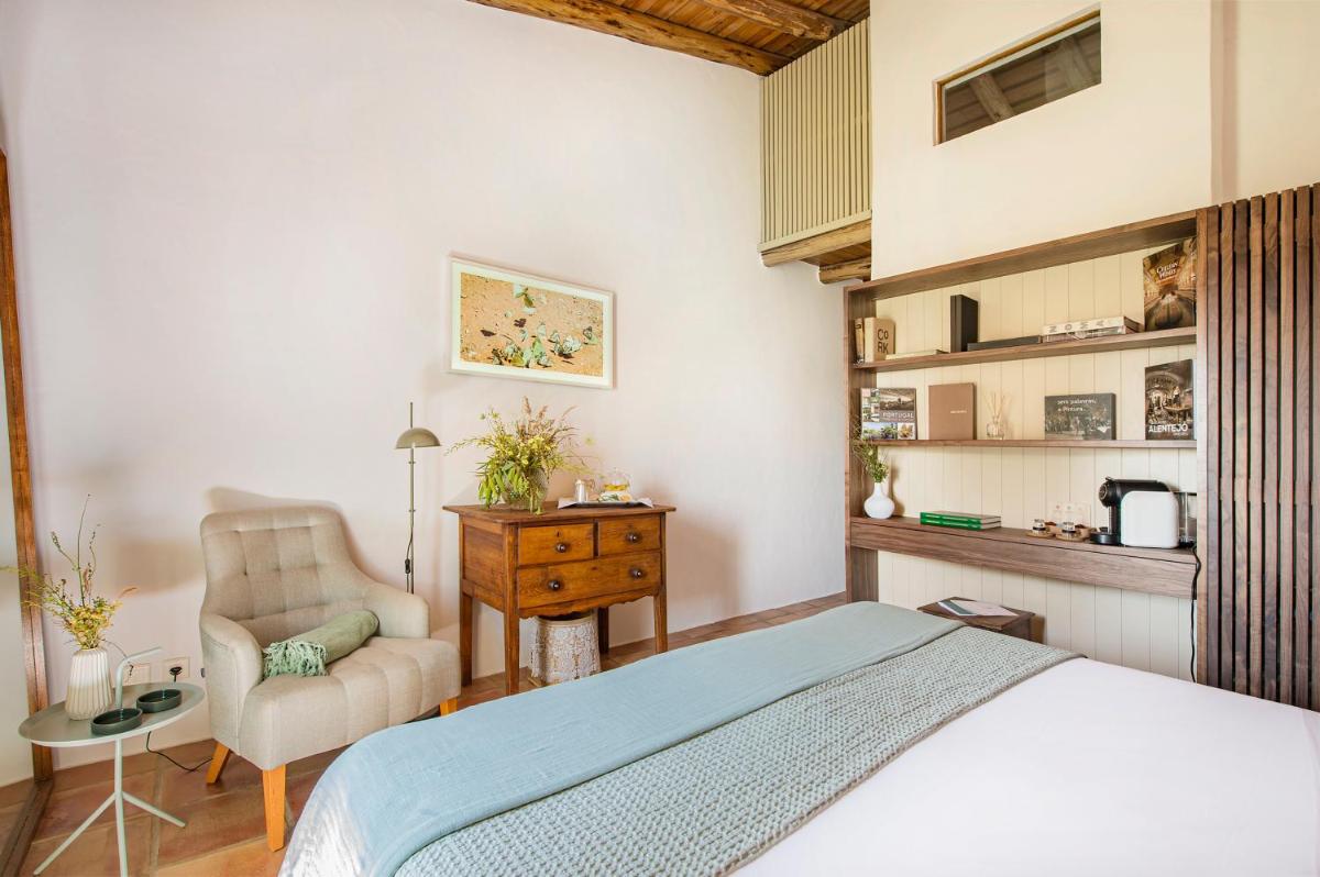 Uma cama ou camas num quarto em Herdade da Malhadinha Nova - Relais & Châteaux