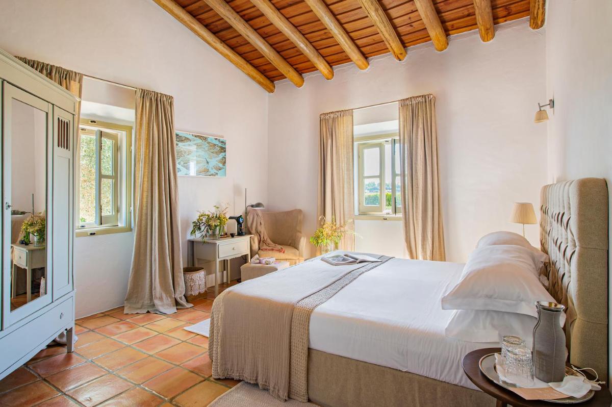 Uma cama ou camas num quarto em Herdade da Malhadinha Nova - Relais & Châteaux
