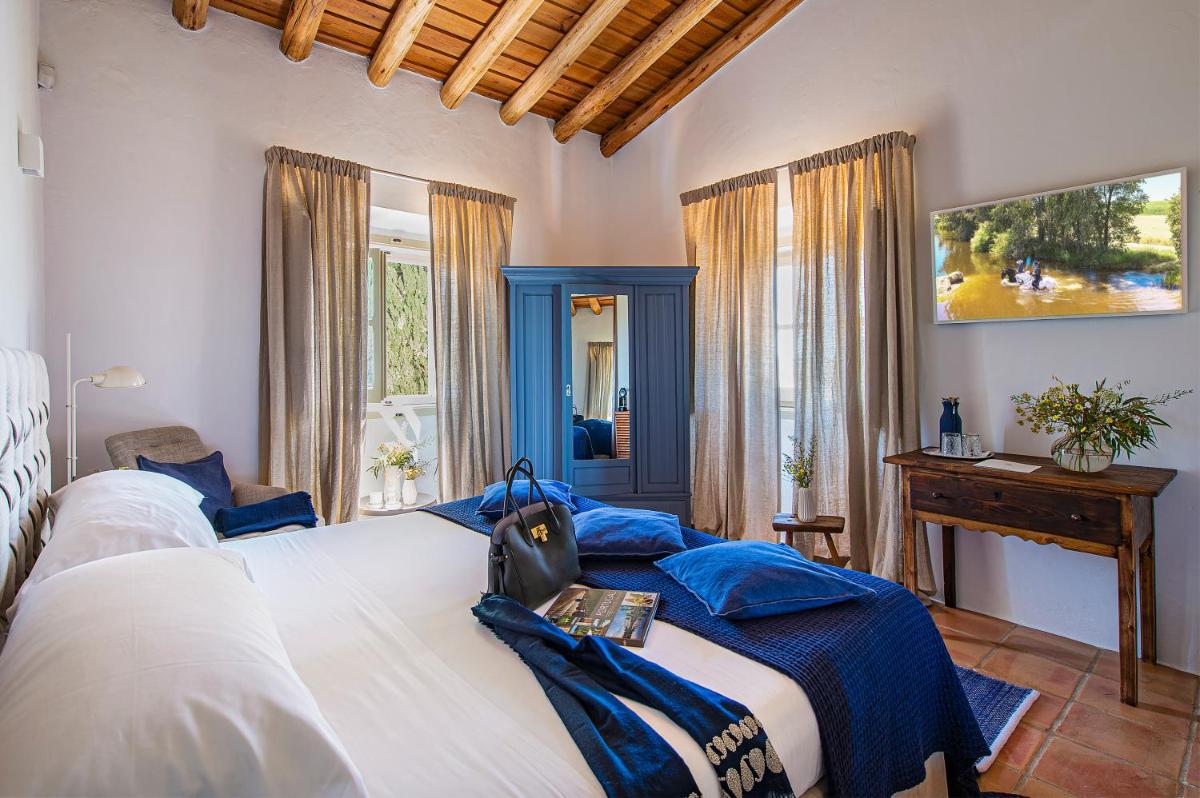 Uma cama ou camas num quarto em Herdade da Malhadinha Nova - Relais & Châteaux