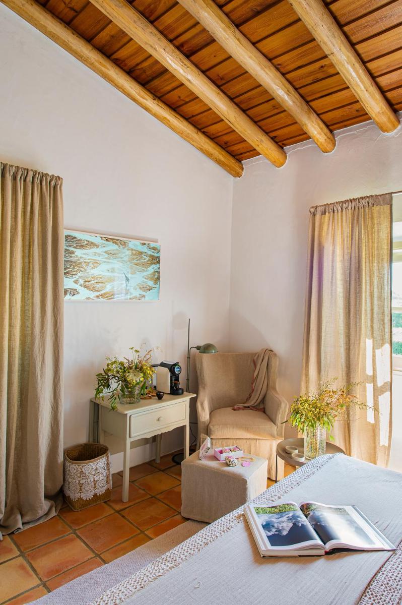 Uma área de estar em Herdade da Malhadinha Nova - Relais & Châteaux