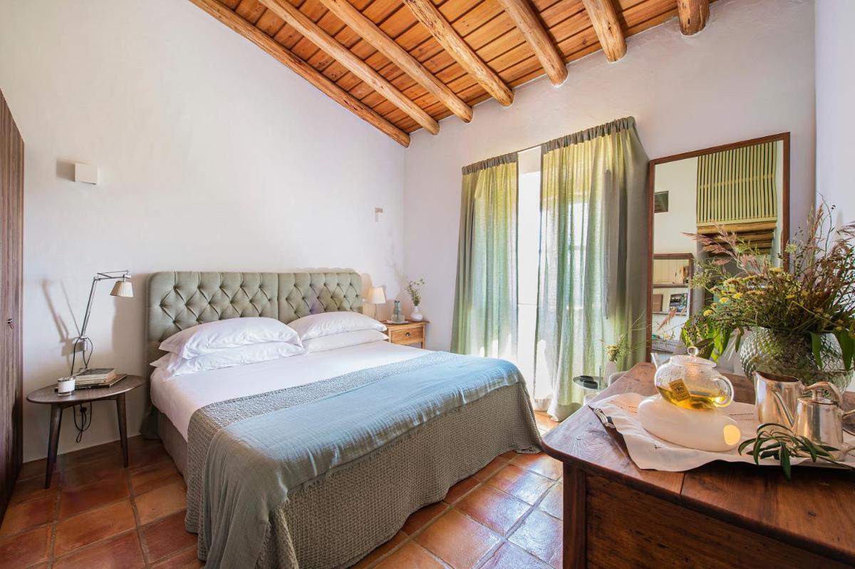 Uma cama ou camas num quarto em Herdade da Malhadinha Nova - Relais & Châteaux