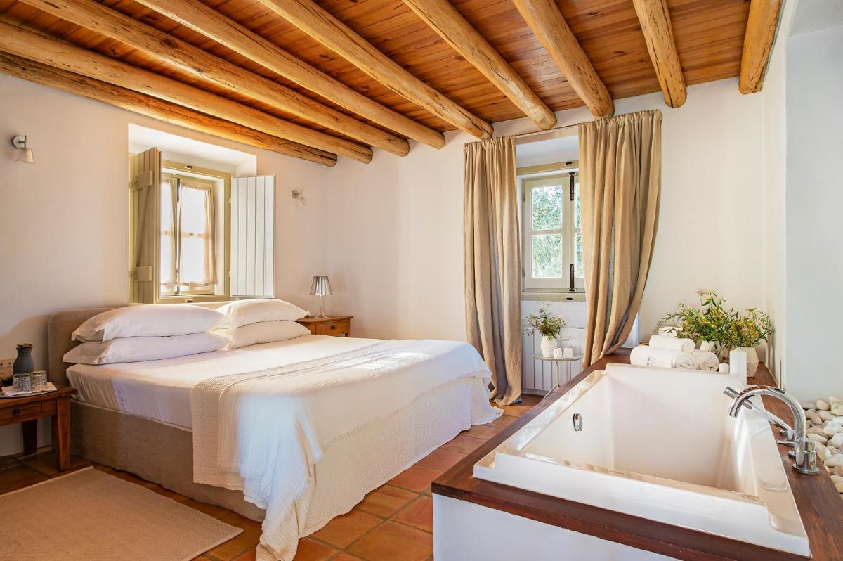 Uma cama ou camas num quarto em Herdade da Malhadinha Nova - Relais & Châteaux