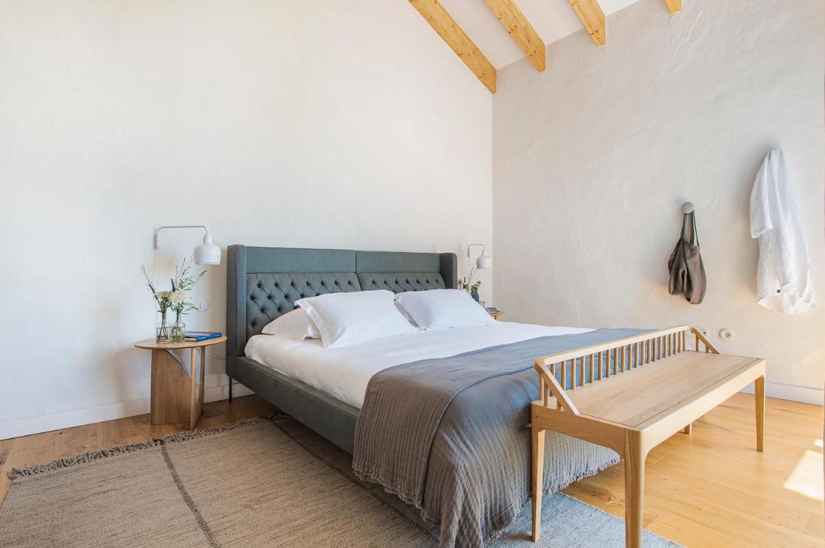 Uma cama ou camas num quarto em Herdade da Malhadinha Nova - Relais & Châteaux