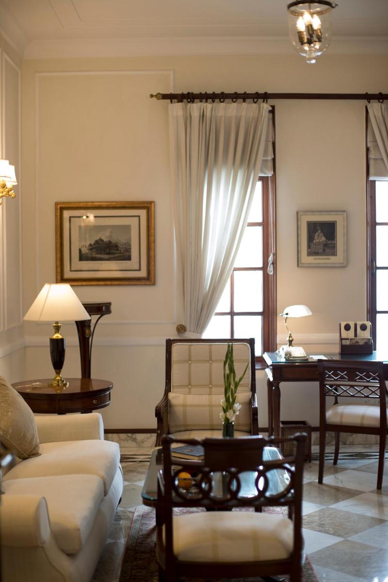 a living room with a couch and a table at The Imperial, New Delhi in New Delhi a living room with a couch and a table at The Imperial, New Delhi in New Delhi