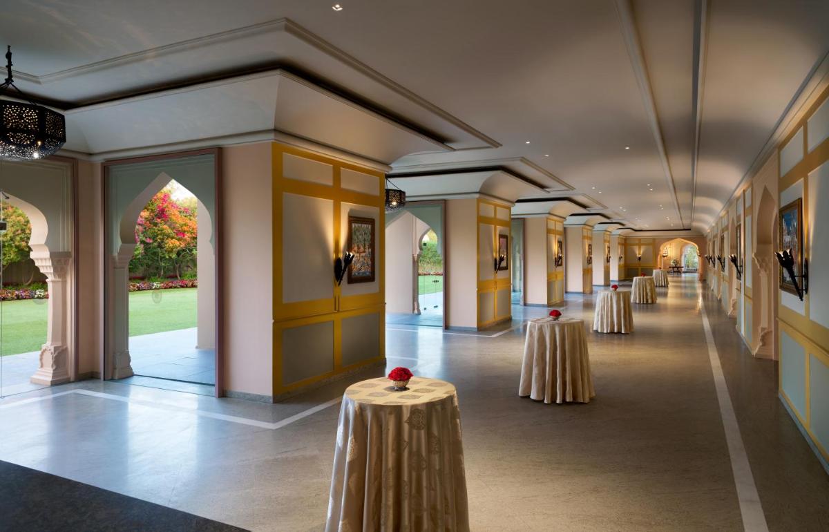 a row of tables in a hallway in a building at Fairmont Jaipur in Jaipur