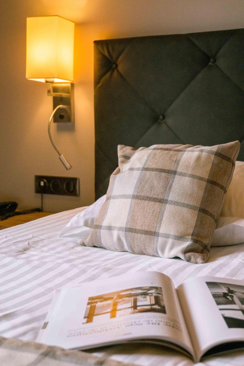 Un ou plusieurs lits dans un hébergement de l'établissement Les Gentianettes Hotel & Spa