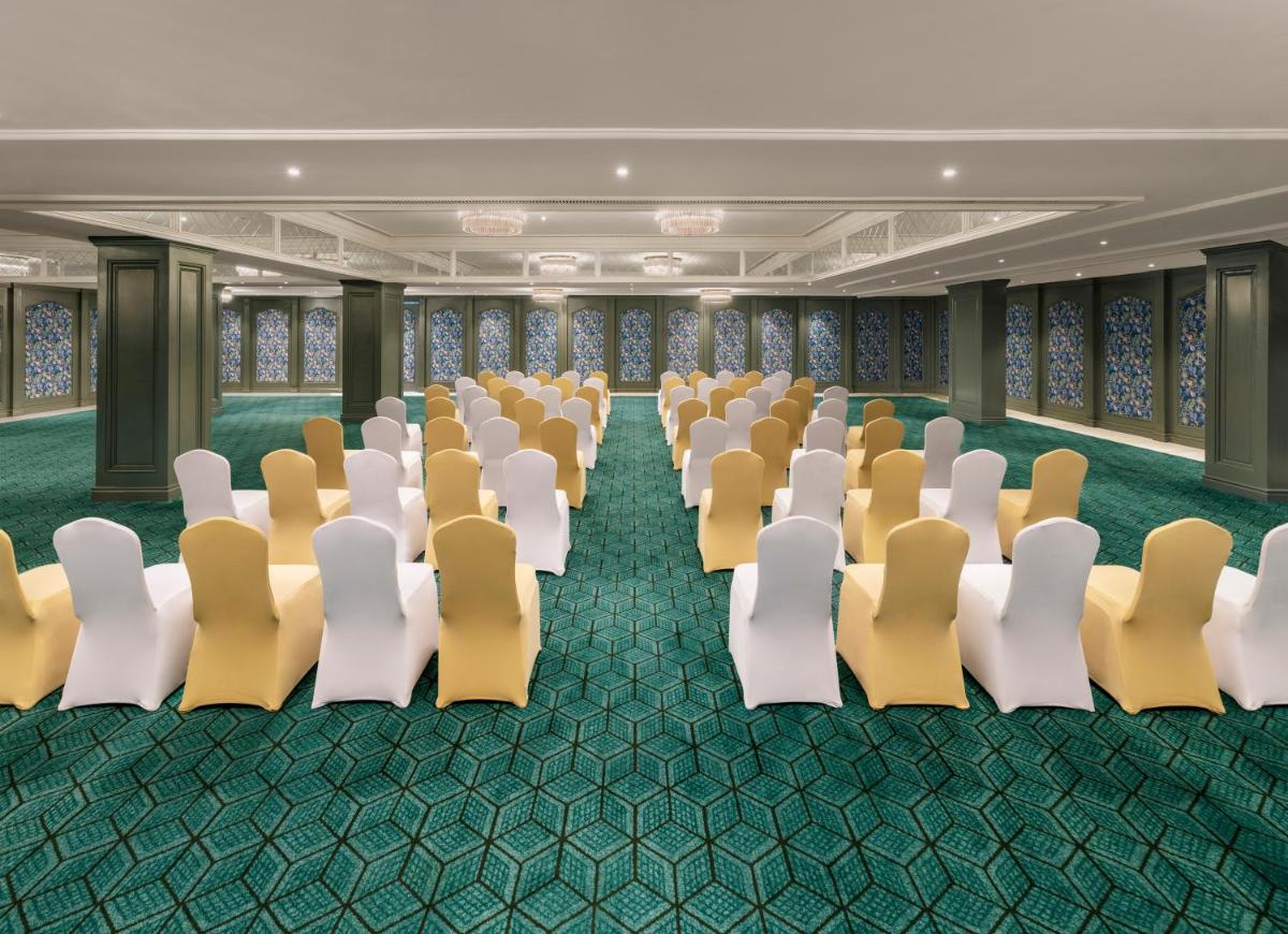 an empty conference room with white and yellow chairs at Tajview, Agra-IHCL SeleQtions in Agra