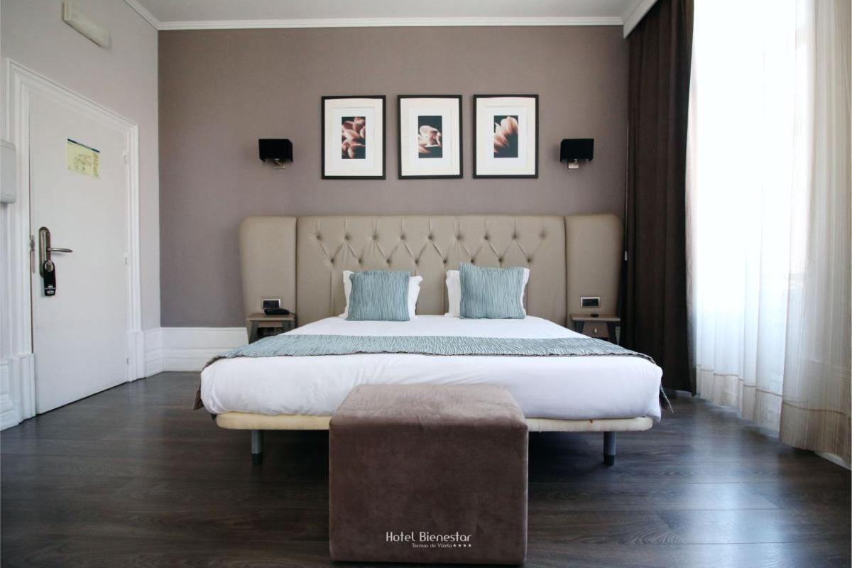 Uma cama ou camas num quarto em Hotel Bienestar Termas De Vizela