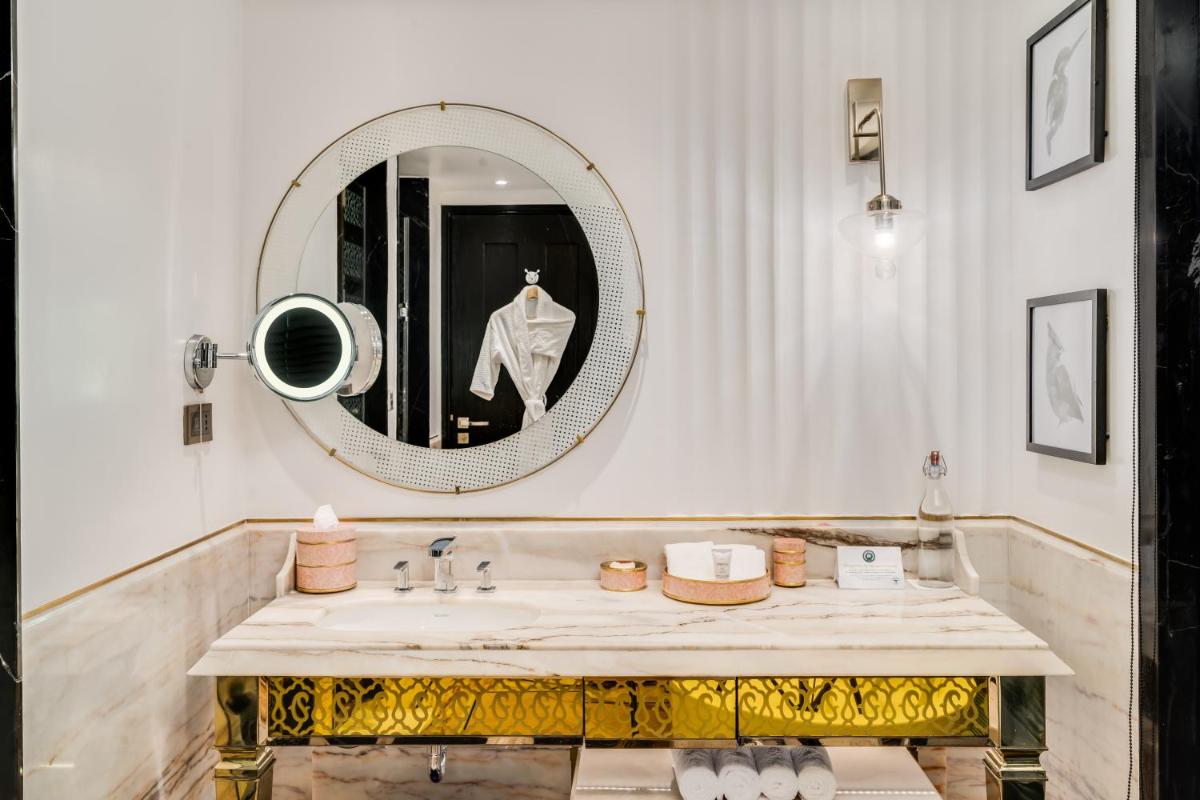 a bathroom with a sink and a mirror at ITC Narmada, a Luxury Collection Hotel, Ahmedabad in Ahmedabad