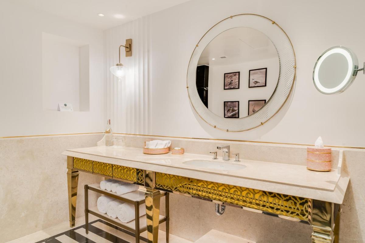 a bathroom with a sink and a mirror at ITC Narmada, a Luxury Collection Hotel, Ahmedabad in Ahmedabad