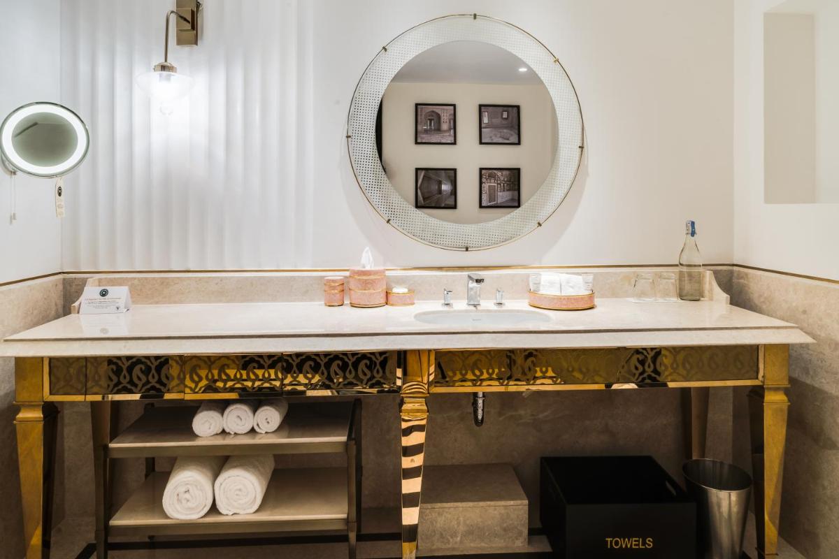 a bathroom with a sink and a mirror at ITC Narmada, a Luxury Collection Hotel, Ahmedabad in Ahmedabad