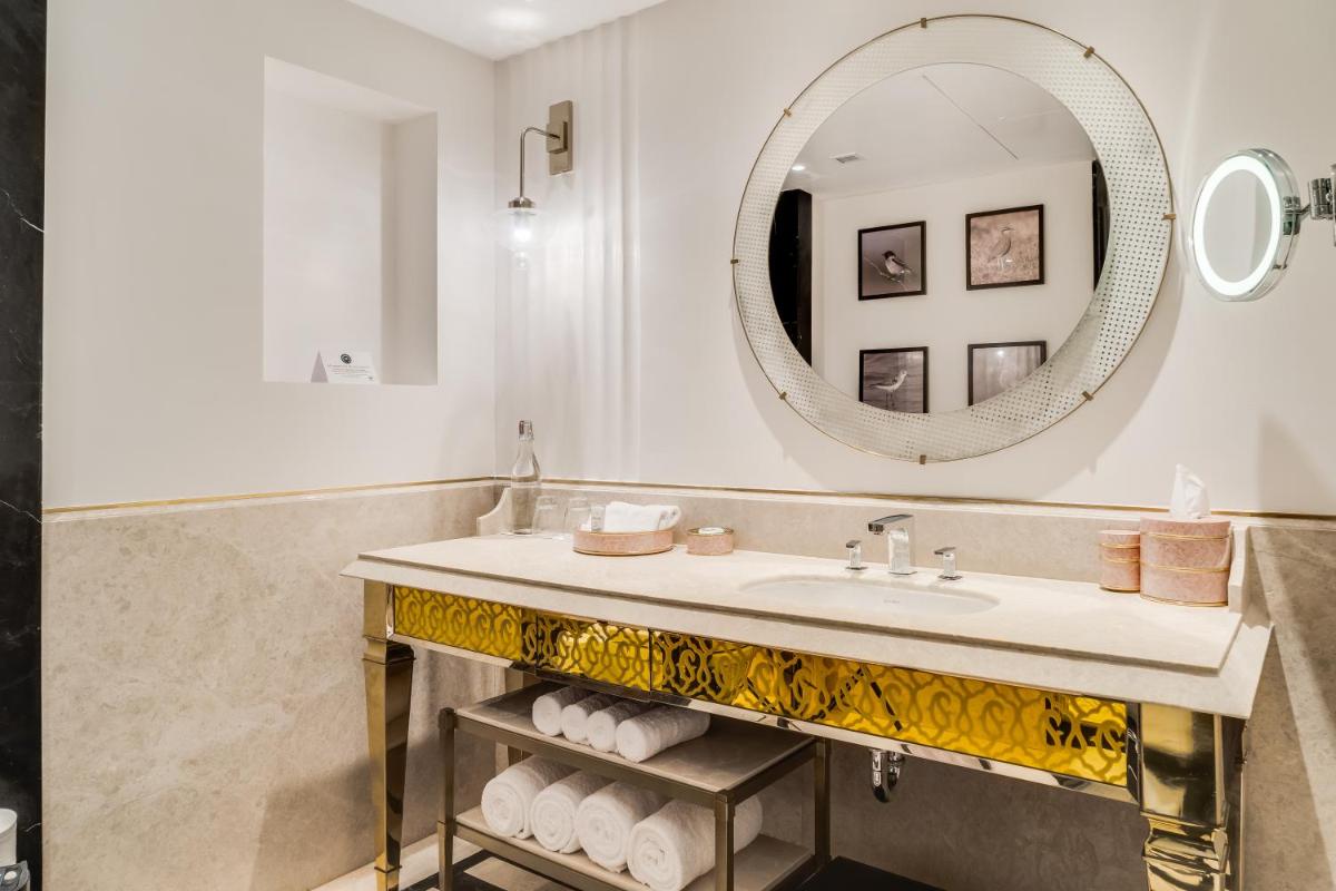 a bathroom with a sink and a mirror at ITC Narmada, a Luxury Collection Hotel, Ahmedabad in Ahmedabad