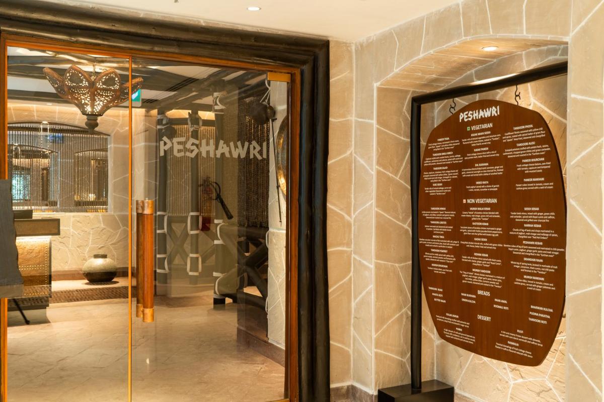 a sign in the window of a store at ITC Narmada, a Luxury Collection Hotel, Ahmedabad in Ahmedabad