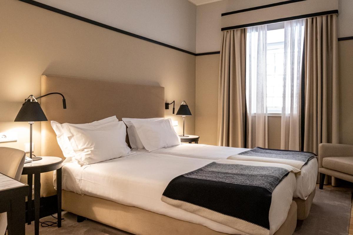 Uma cama ou camas num quarto em Octant Lousa