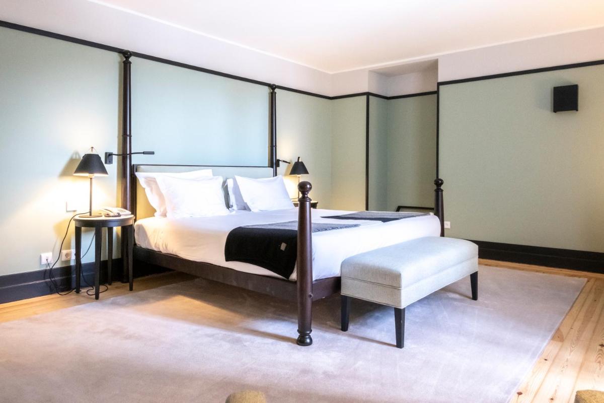 Uma cama ou camas num quarto em Octant Lousa