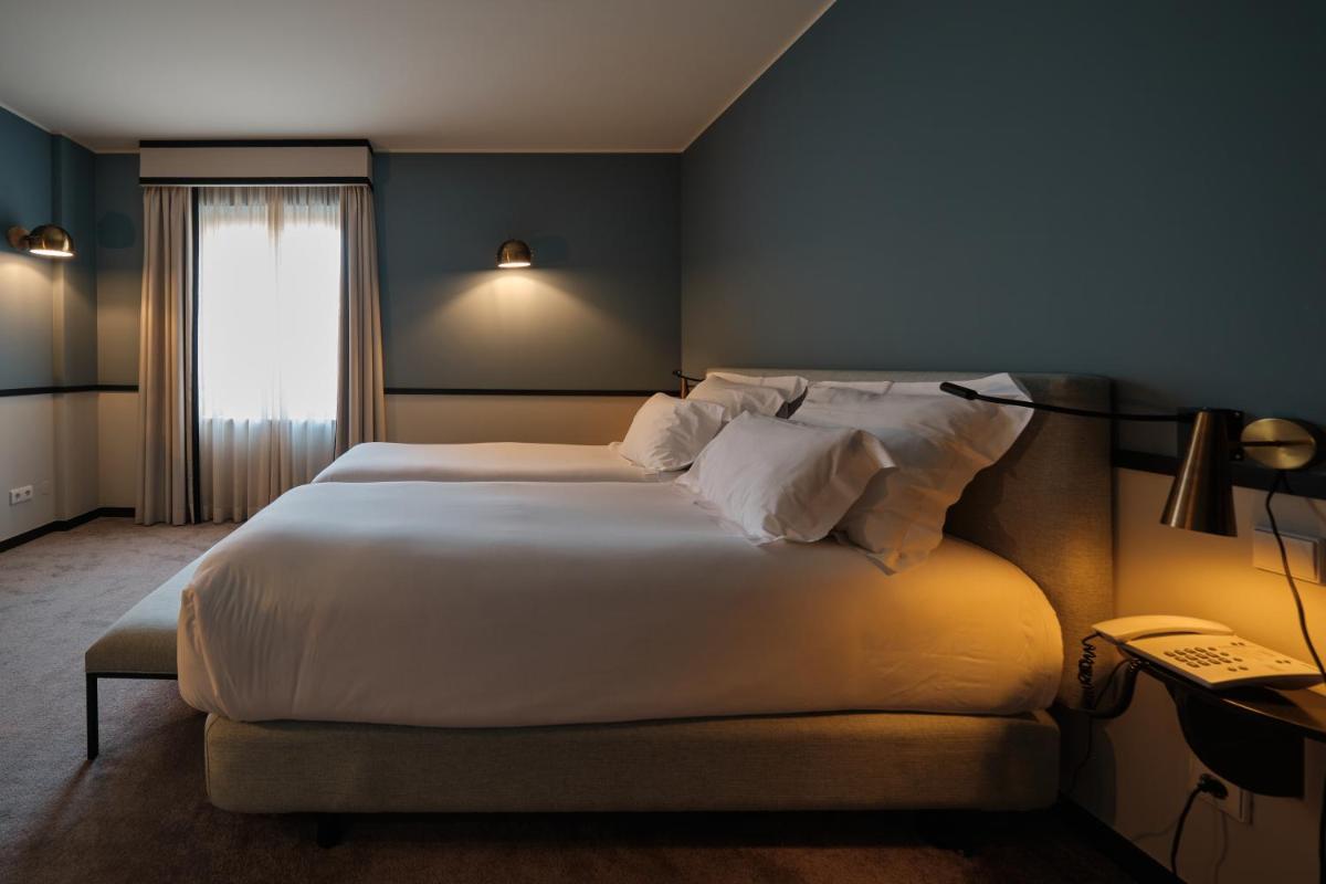 Uma cama ou camas num quarto em Octant Lousa