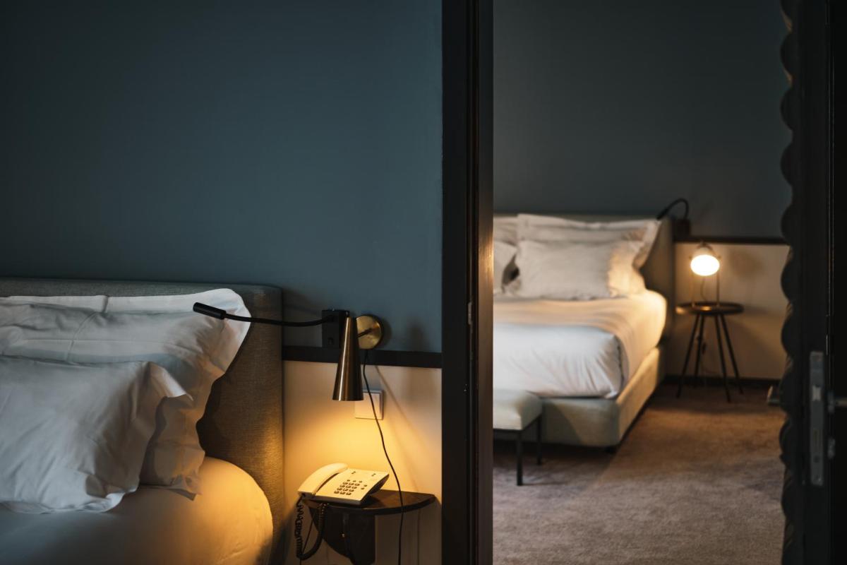Uma cama ou camas num quarto em Octant Lousa