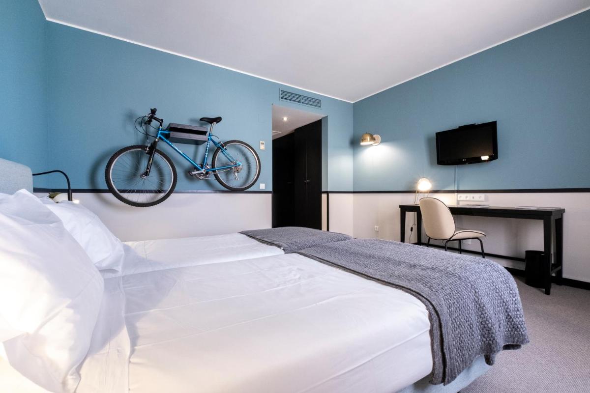 Uma cama ou camas num quarto em Octant Lousa