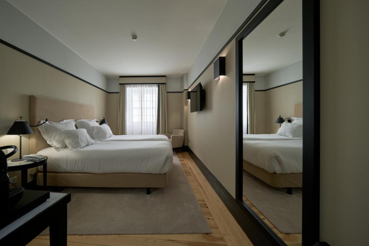 Uma cama ou camas num quarto em Octant Lousa