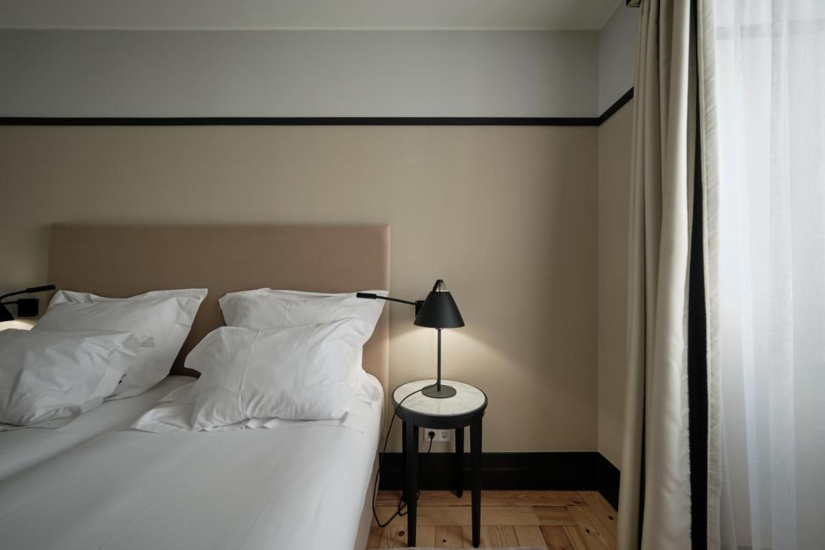 Uma cama ou camas num quarto em Octant Lousa