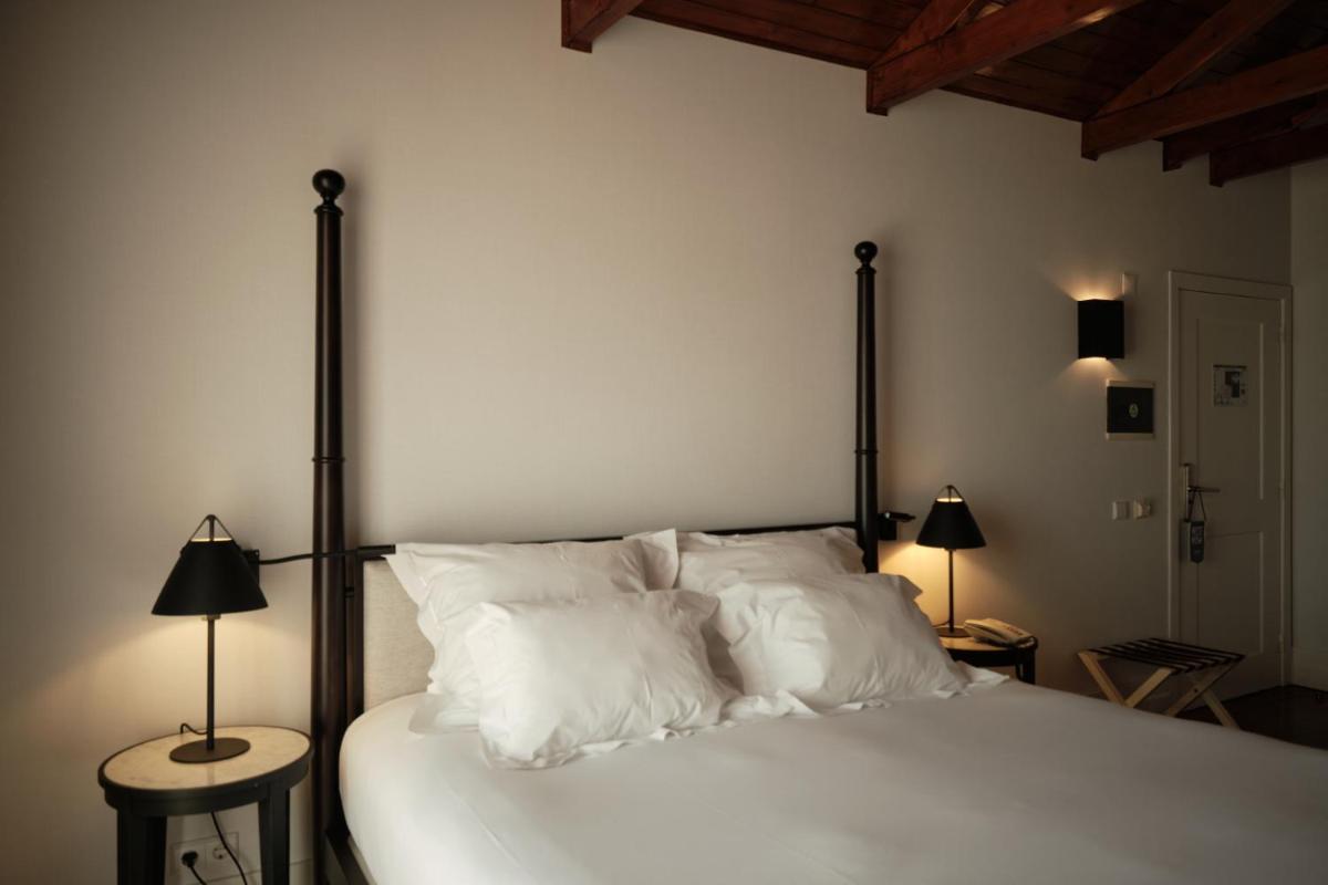 Uma cama ou camas num quarto em Octant Lousa