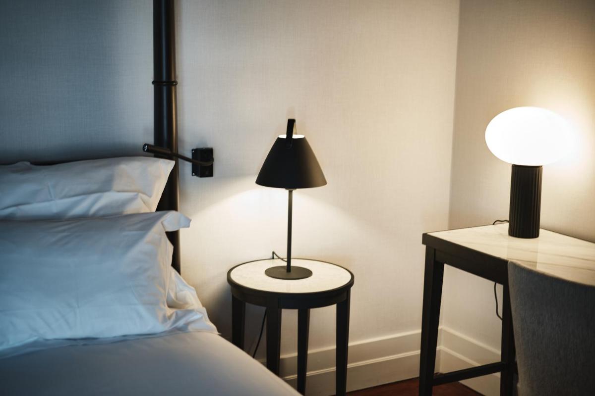 Uma cama ou camas num quarto em Octant Lousa