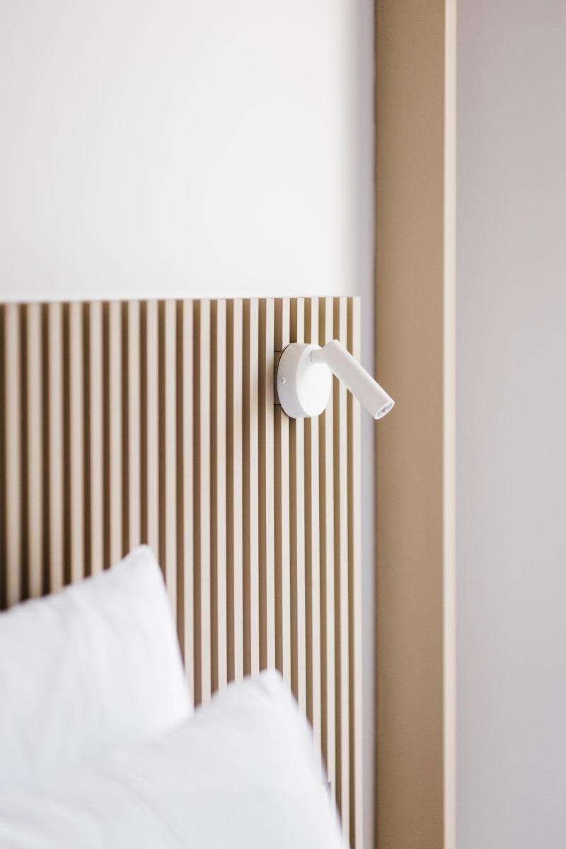 Uma cama ou camas num quarto em Memmo Baleeira - Design Hotels