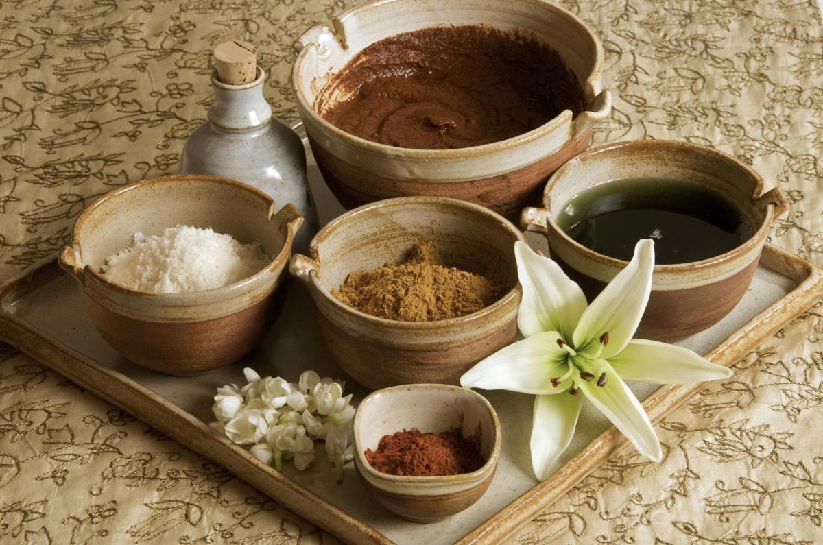 a tray filled with different types of spices on a table at President - IHCL SeleQtions in Mumbai