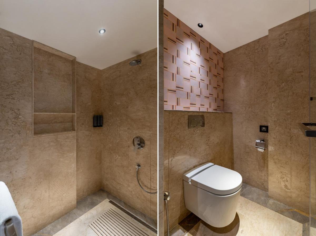 a bathroom with a toilet and a shower at Parallel Hotel Udaipur, a member of Radisson Individuals in Udaipur