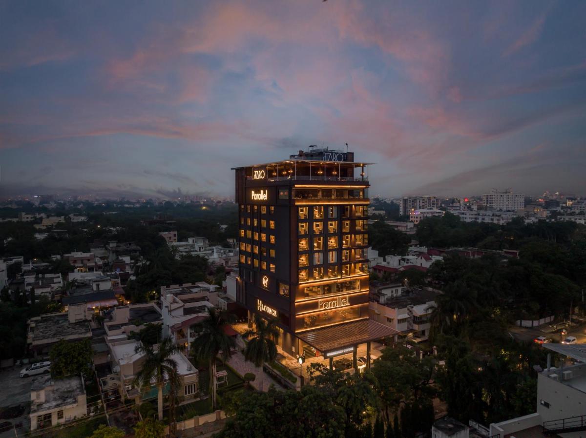 a tall building with lights on in a city at Parallel Hotel Udaipur, a member of Radisson Individuals in Udaipur