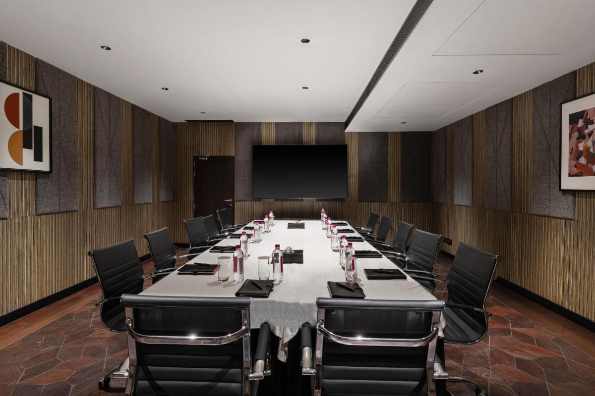 a large conference room with a long table and chairs at Parallel Hotel Udaipur, a member of Radisson Individuals in Udaipur