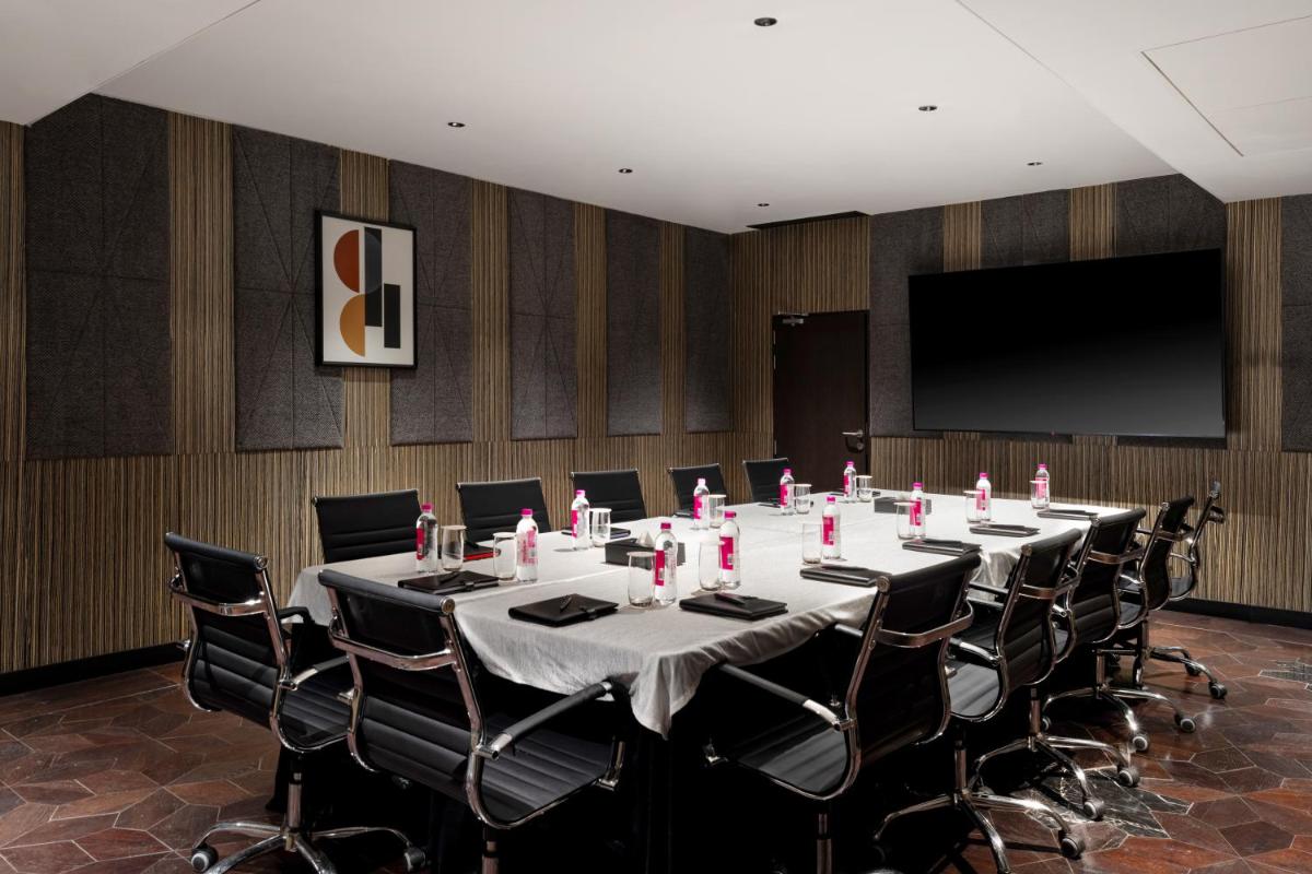 a conference room with a long table and chairs at Parallel Hotel Udaipur, a member of Radisson Individuals in Udaipur
