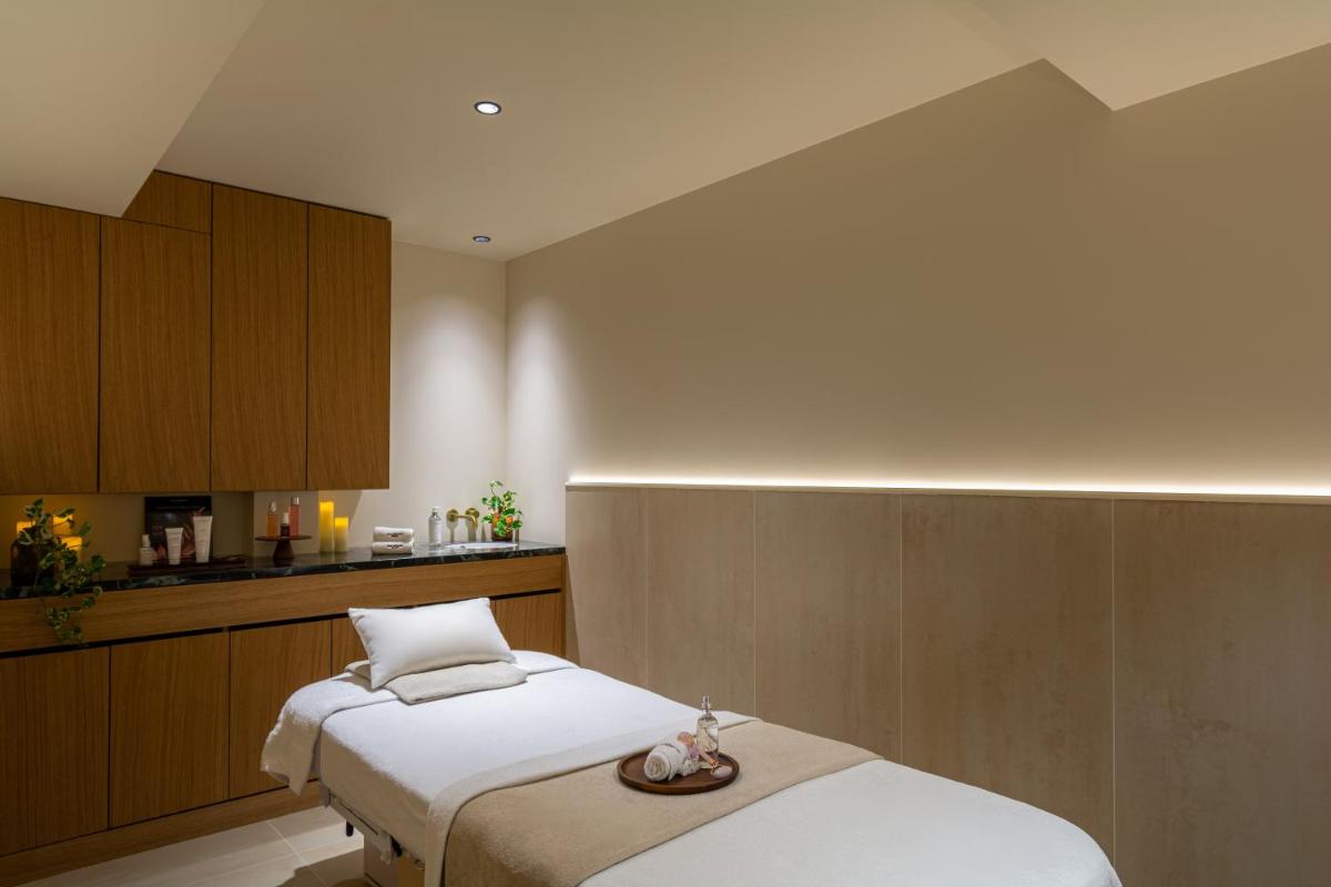 Un ou plusieurs lits dans un hébergement de l'établissement Hôtel & SPA Napoléon